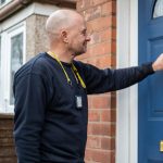 Photo of a trade colleague knocking on door