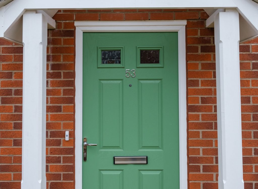 Photo of house with green door