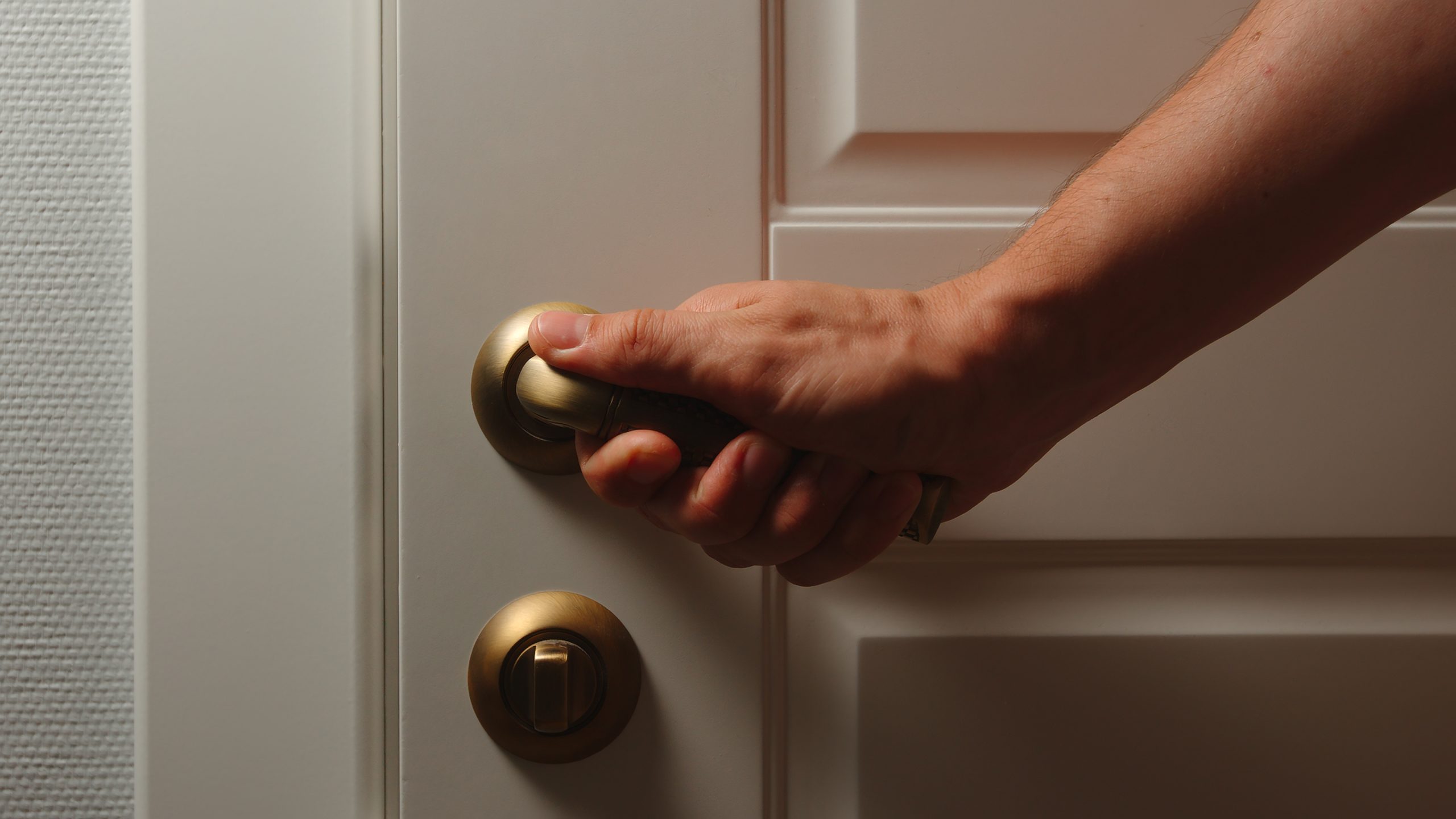 hand on inside door handle