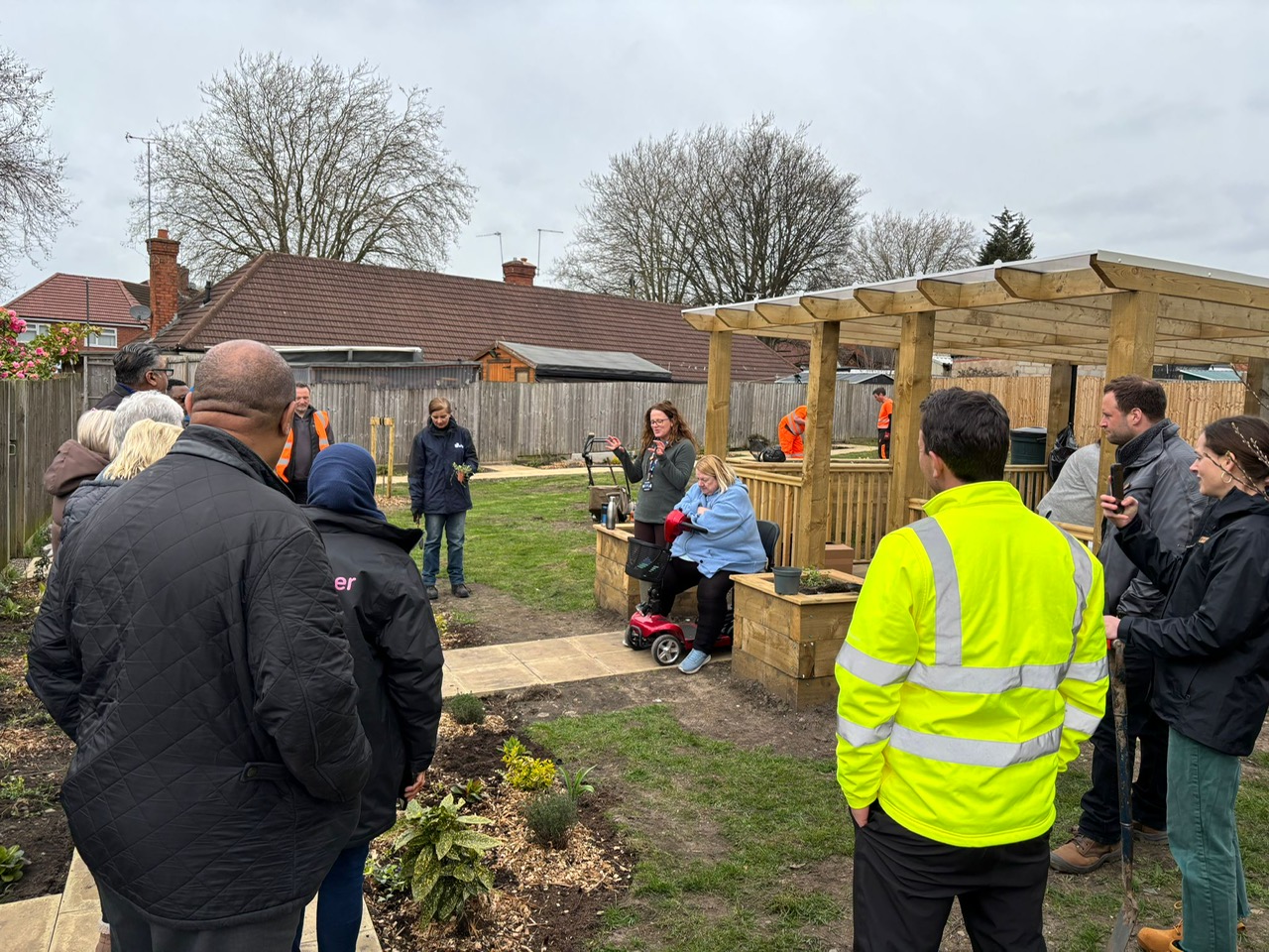 People standing in a community garden in Palfrey